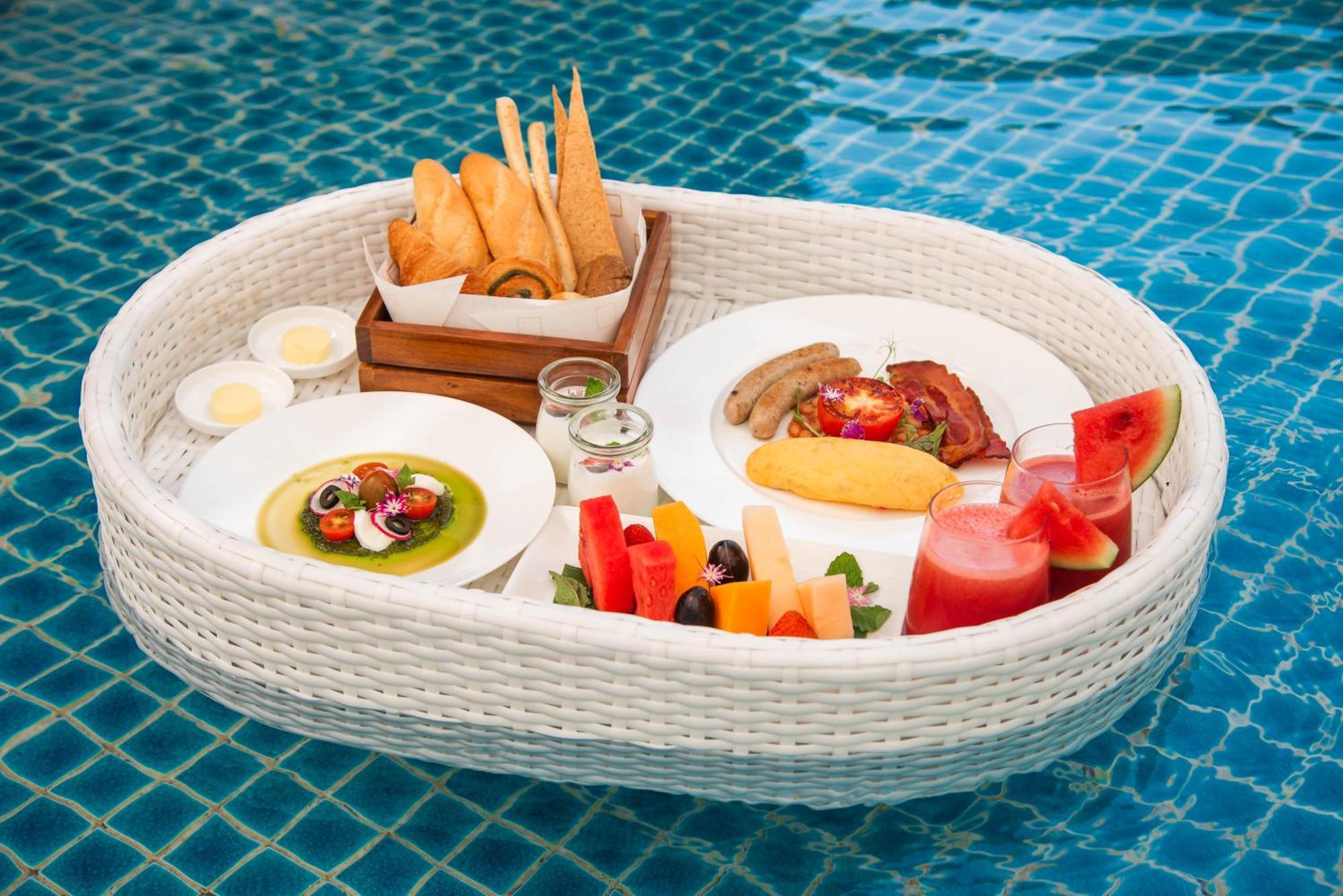Mai House Saigon Hotel Ho Chi Minh City Exterior photo A floating breakfast at a resort in Bali, Indonesia